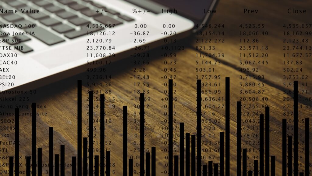 composite image of laptop on a desk with graphic background