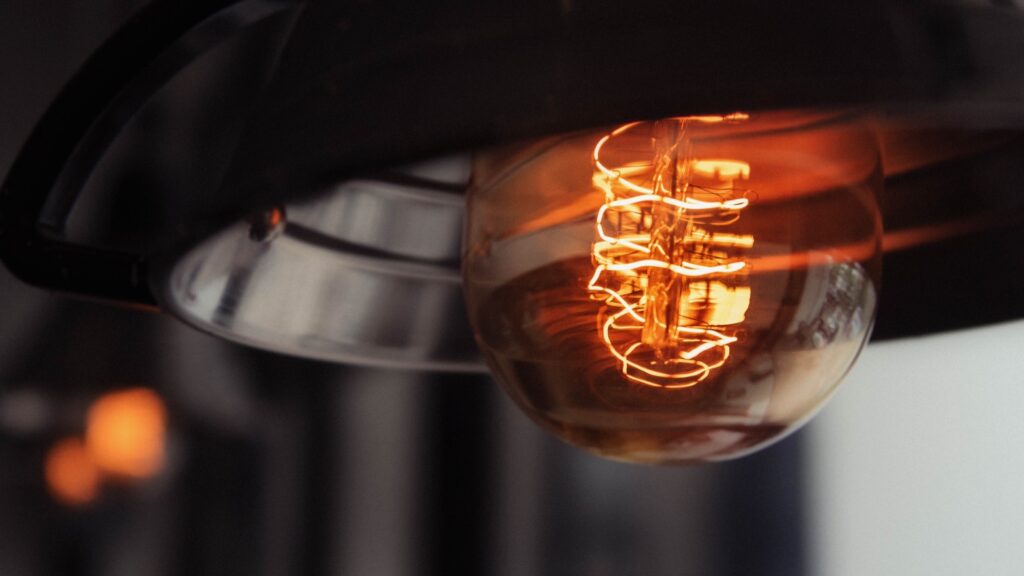 closeup shot of a lit large lightbulb with a blurred background